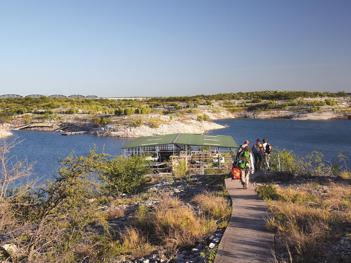 All aboard! Researchers approach a boat landing at Amistad National Recreation Area. PHOTO Hans Landel