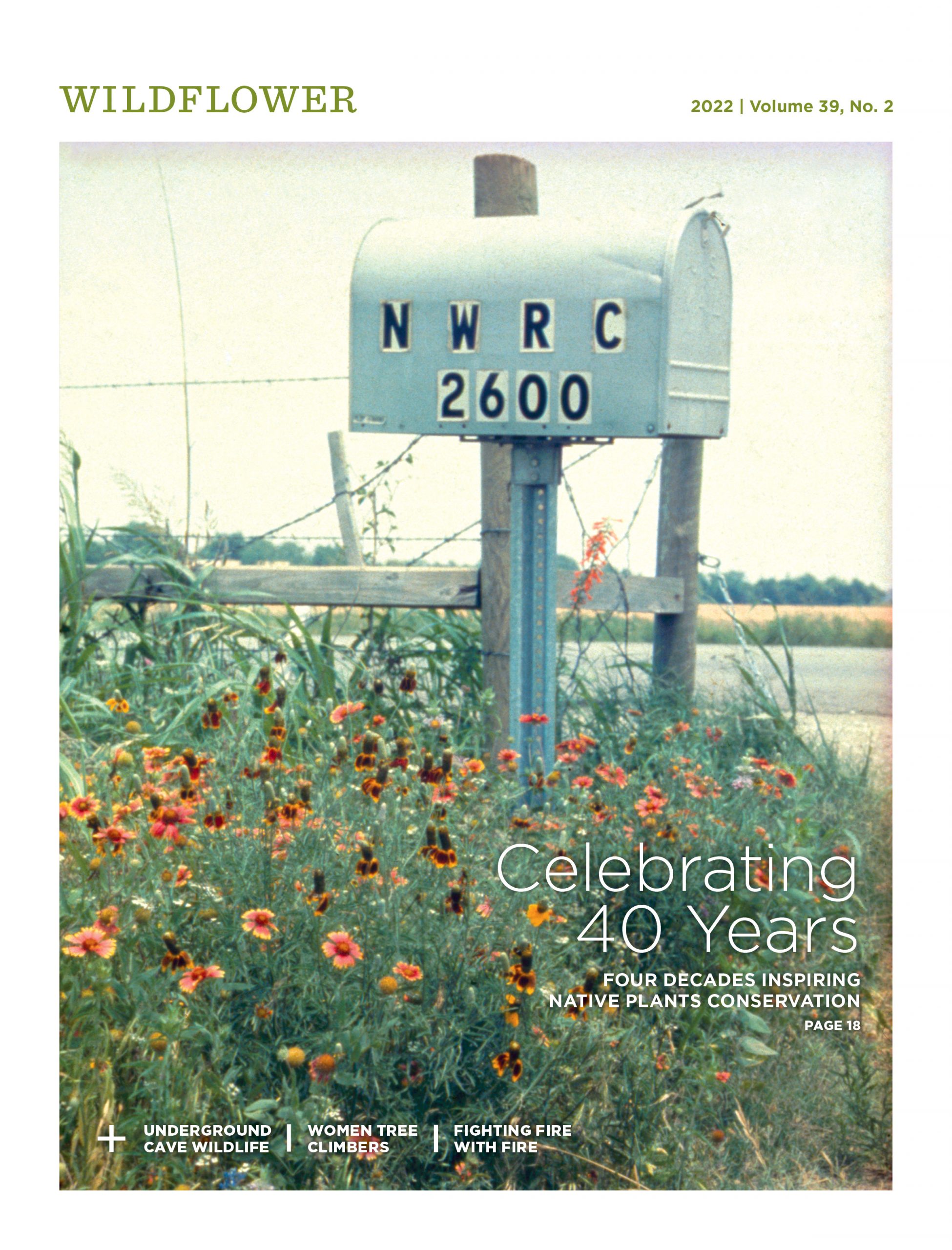 The cover of Wildflower Magazine featuring a vintage photo of our mailbox at our first campus. it has the address NWRC 2600 on it and is surrounded by wildflowers.